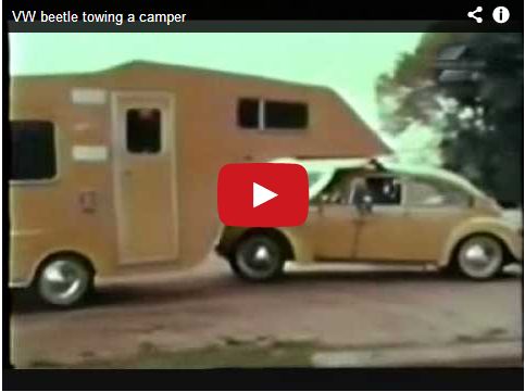 VW beetle towing a camper